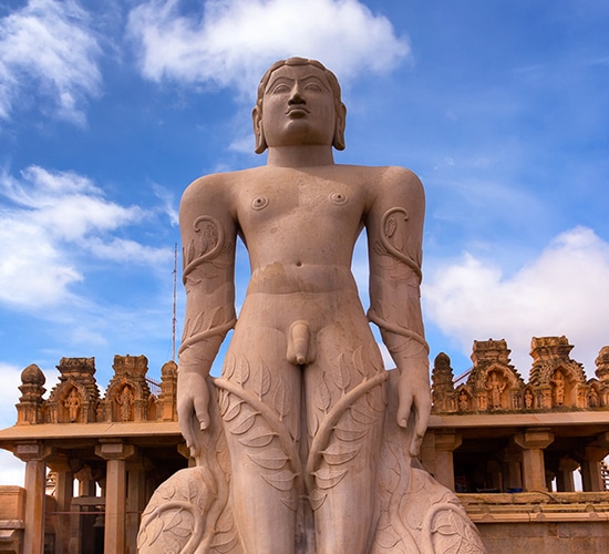 Gomateshwara a statue with its arms pointing downwards and face upright in Kayotsarga facing north